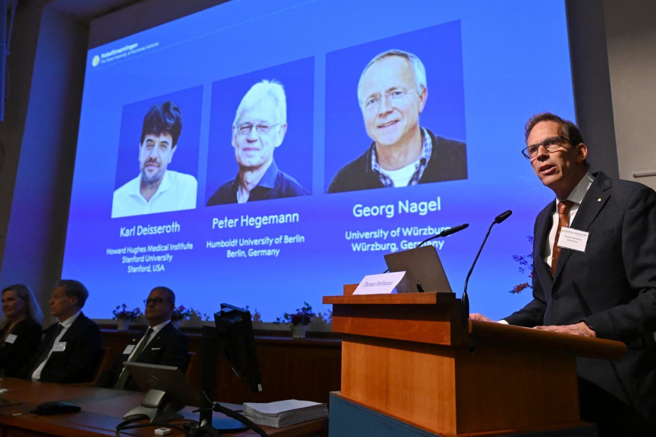 Karl Deisseroth, Peter Hegemann and Georg Nagel are announced as the winners of the 2026 Nobel prize in physiology or medicine by Nobel committee secretary general Thomas Perlmann