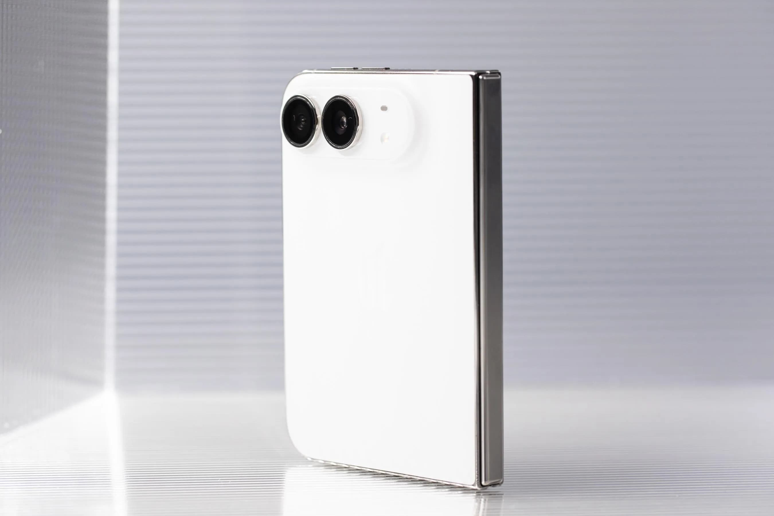 The back of a folded iPhone Duo showing its wider size and its camera bump.
