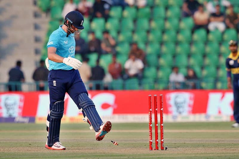 England’s Will Jacks walks back to the pavilion after being clean-bowled during the ODI tri-series match against Sri Lanka at Gaddafi Stadium.