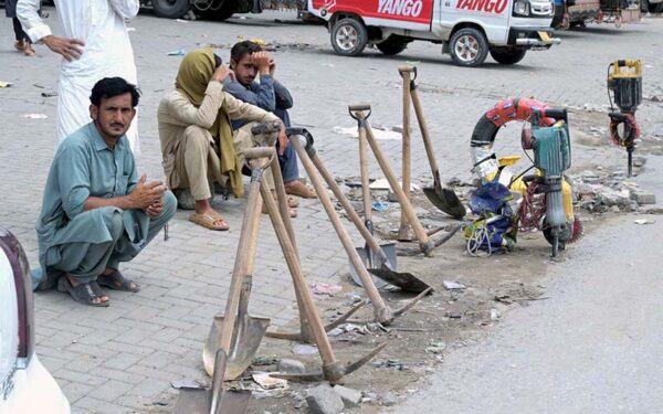 Labourers Wait Along Roadside for Work in Federal Capital Labourers Wait Along Roadside for Work in Federal Capital