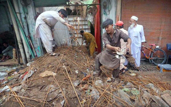 Residents clear debris after shop roof collapse in provincial capital Residents clear debris after shop roof collapse in provincial capital