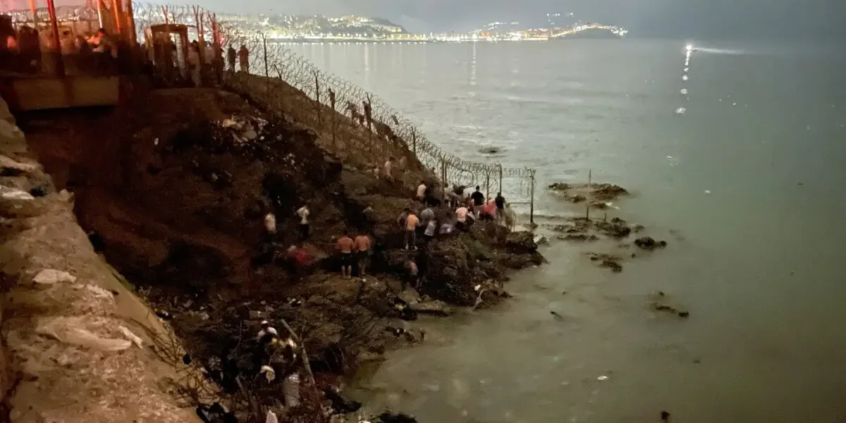 Migrants storm Moroccan town near Ceuta, torch vehicles