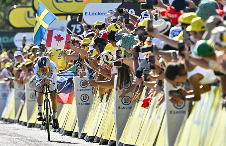 Evenepoel wins Tour de France time-trial, cuts Pogacar’s lead