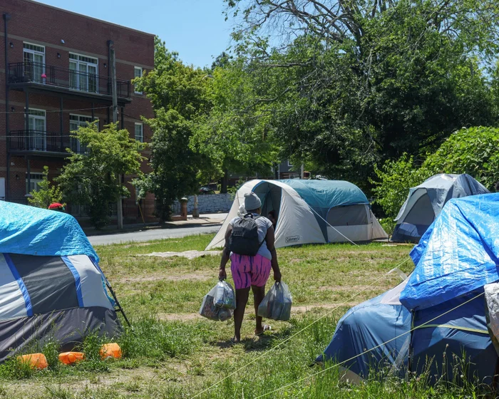 Atlanta officials face backlash for clearing unhoused people’s belongings near World Cup site Atlanta officials face backlash for clearing unhoused people’s belongings near World Cup site
