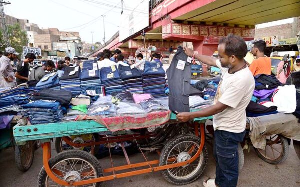 Street vendors showcase diverse products in busy markets Street vendors showcase diverse products in busy markets