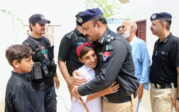 Police officers honor martyrs' families during annual week Police officers honor martyrs' families during annual week