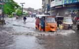 Auto rickshaws navigate flooded roads in Hyderabad