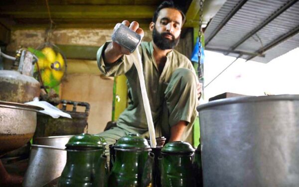 Vendor continues traditional tea preparation in historic Peshawar bazaar Vendor continues traditional tea preparation in historic Peshawar bazaar