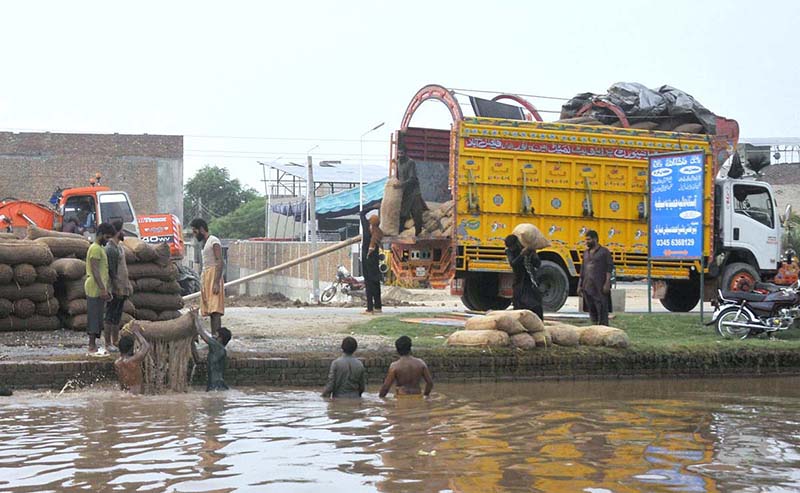 Labourers Wash Potatoes in Canal Before Market Transport