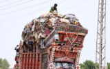 Gypsy man gathers valuables from waste at Mohenjo-Daro Airport Road