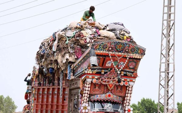 Gypsy man gathers valuables from waste at Mohenjo-Daro Airport Road