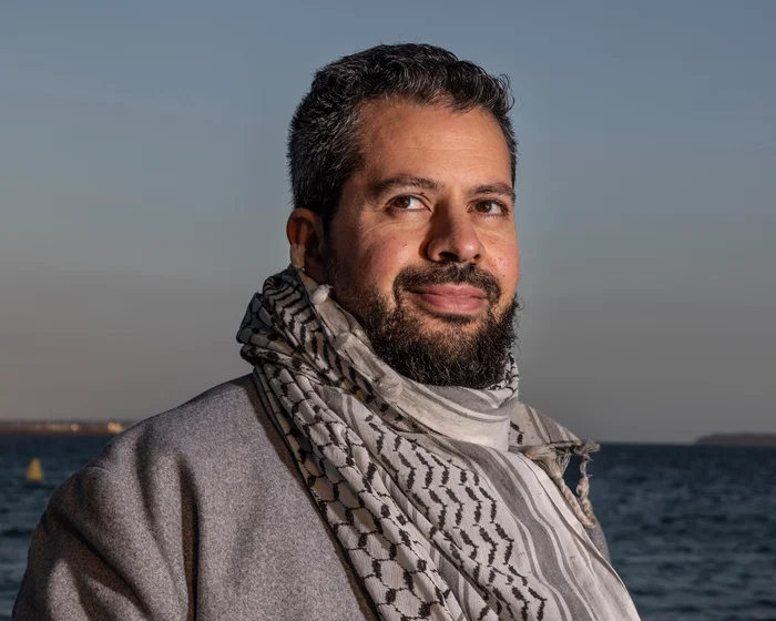 Palestinian careers adviser sues NSW government over keffiyeh ban Palestinian careers adviser sues NSW government over keffiyeh ban