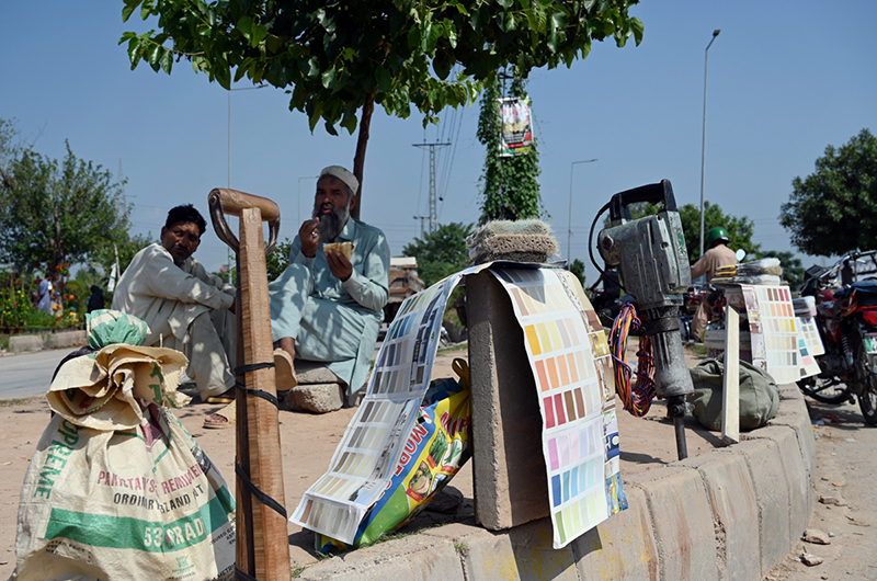 Daily-wage labourers wait for work in Federal Capital