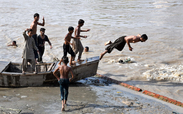 Young people cool off in Rice Canal Young people cool off in Rice Canal