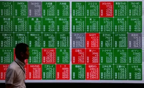 Tech stocks lead gains in Asian markets as oil prices fall