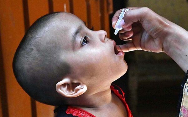 Lady Health Worker Administers Polio Drops in Anti-Polio Campaign Lady Health Worker Administers Polio Drops in Anti-Polio Campaign