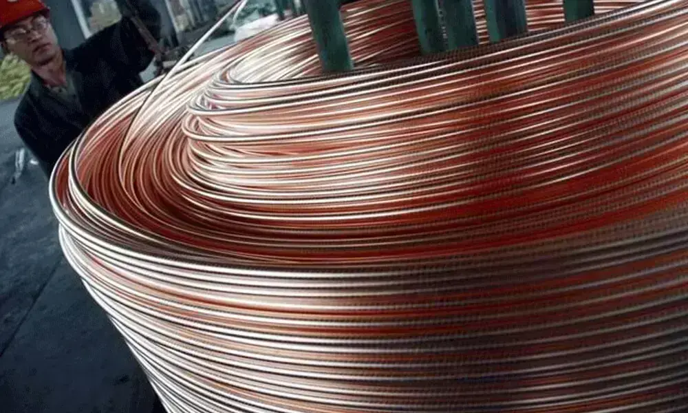 Copper prices hold near record levels amid oil price surge