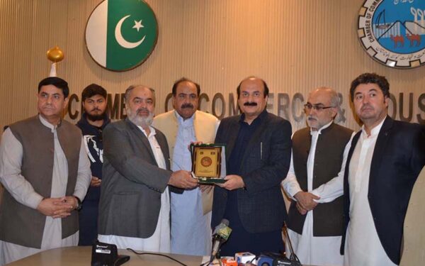 QCCI President Honors Youth Program Chairman with Commemorative Shield