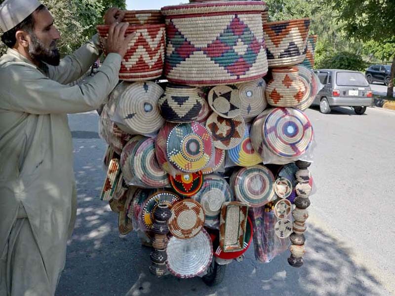 Street vendors continue their daily business in F-10 Markaz and Khayyam Chowk