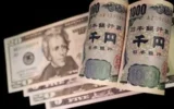 Currencies fluctuate as global markets seek direction